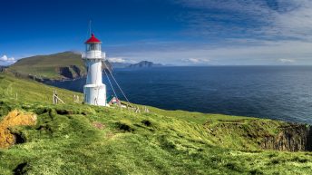 Things to do in Denmark Faroe Islands Travel. Panoramic view of Old lighthouse on the beautiful island Mykines. Best time to visit Faroe Islands.